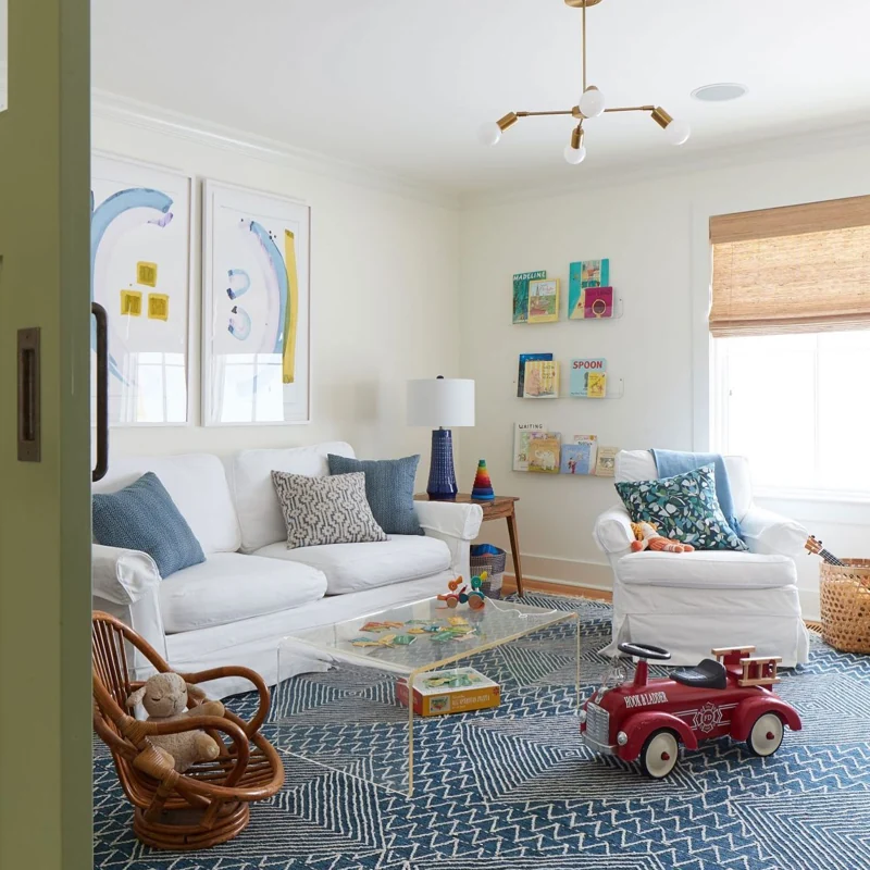 Blue and white geometric patterned area rug in a modern kids' playroom.