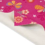 Close-up of pink butterfly carpet with a sketch pad.