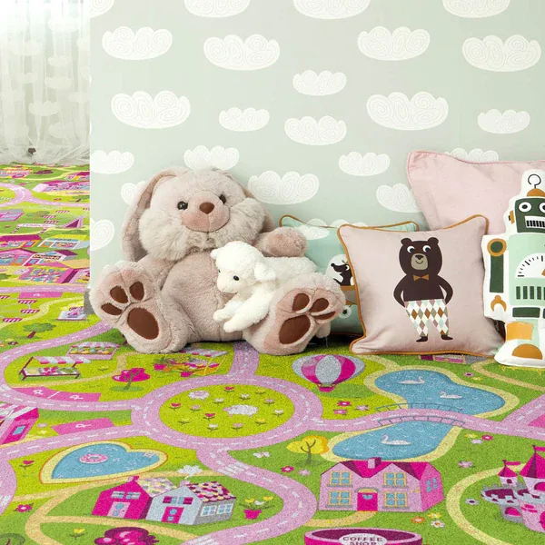 Kids' playroom featuring a pink and green village road map carpet with plush toys.