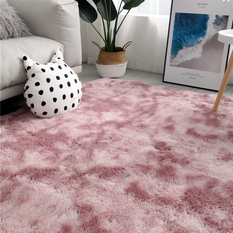 Modern living space with a soft, shaggy pink faux fur rug.