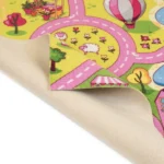 Pink and green village road carpet showing felt non-slip backing.