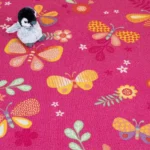Pink butterfly play carpet showing felt non-slip backing.
