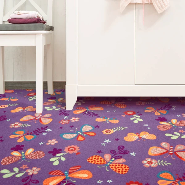 Purple kids' carpet with colorful butterflies and flowers.