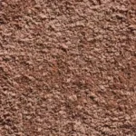 Close-up texture of soft brown plush carpet pile fabric