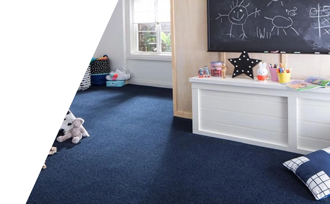 Navy blue wall-to-wall carpet in a kids playroom