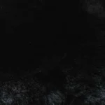 Dark black plush faux fur texture background close-up