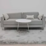 Detailed close-up view of a soft white faux fur texture