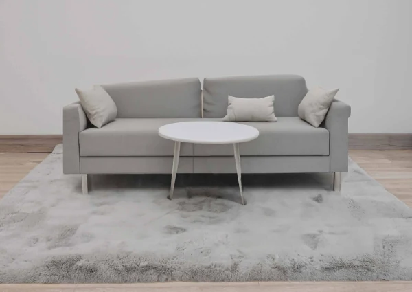 Detailed close-up view of a soft white faux fur texture
